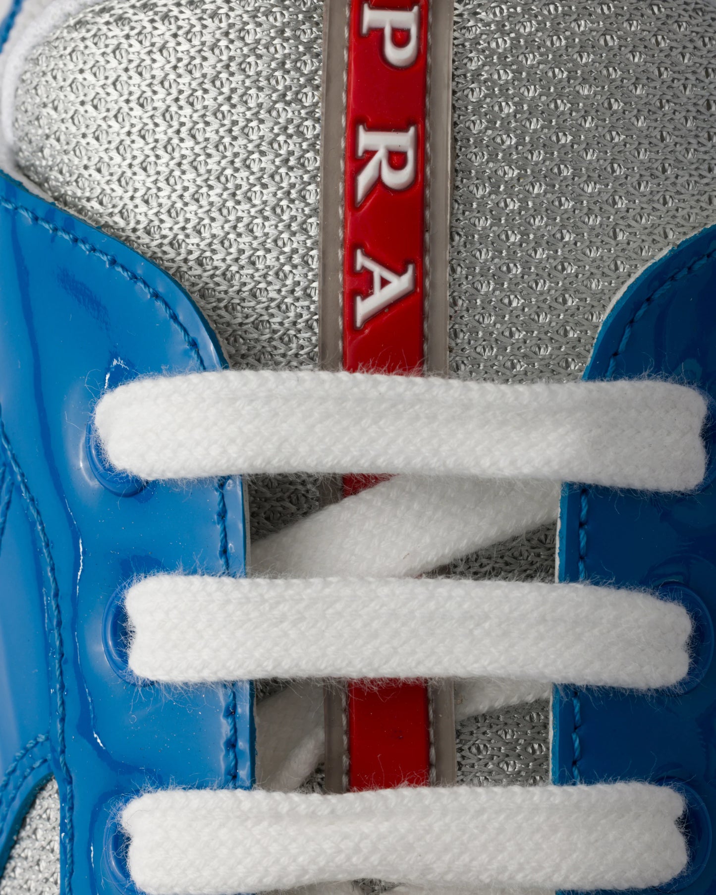 Sneakers Prada America’s Cup en cuir verni et tissu technique