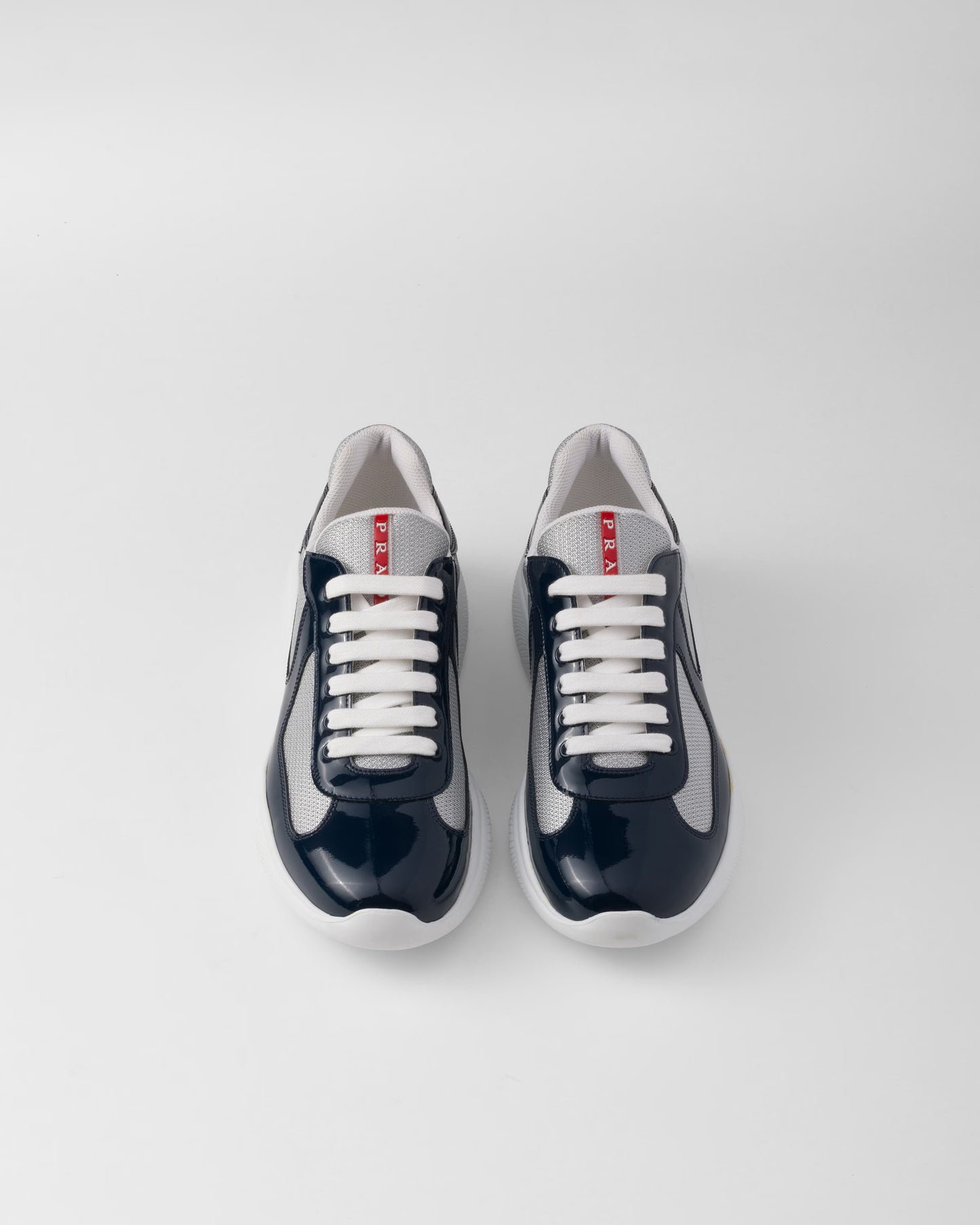 Sneakers Prada America’s Cup en cuir verni et tissu technique