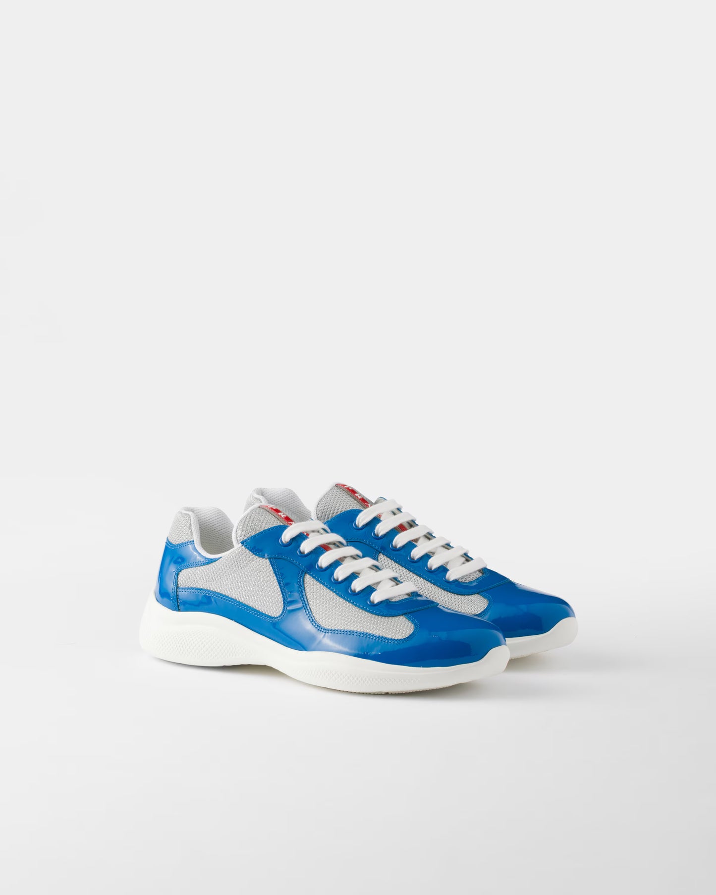 Sneakers Prada America’s Cup en cuir verni et tissu technique